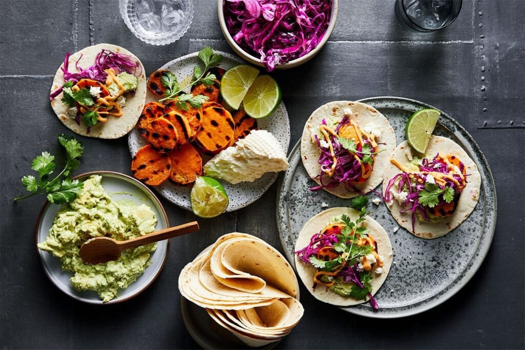 grilled-sweet-potato-tacos-with-tangy-guac-red-cabbage-spicy-mayo-and-queso-fresco-212458-2 (1)